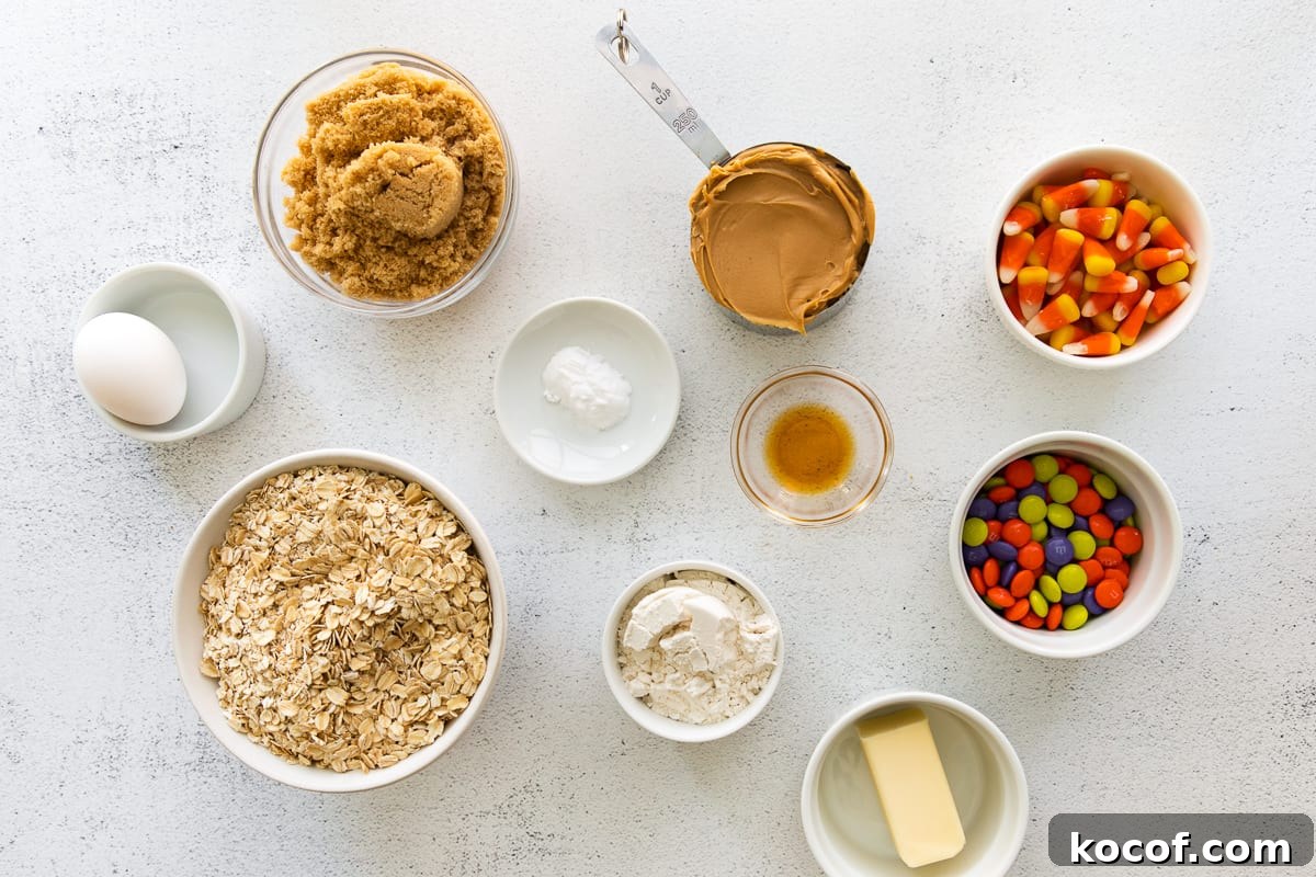 Spooky Halloween Monster Cookie Recipe for Party Treats 10 Ingredients for Halloween monster cookies organized in bowls.