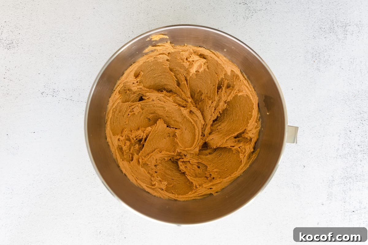 Spooky Halloween Monster Cookie Recipe for Party Treats 11 Creamed peanut butter in a mixing bowl.