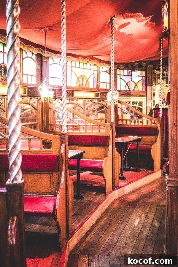 the red seats inside the Musee des Arts Forains in Paris