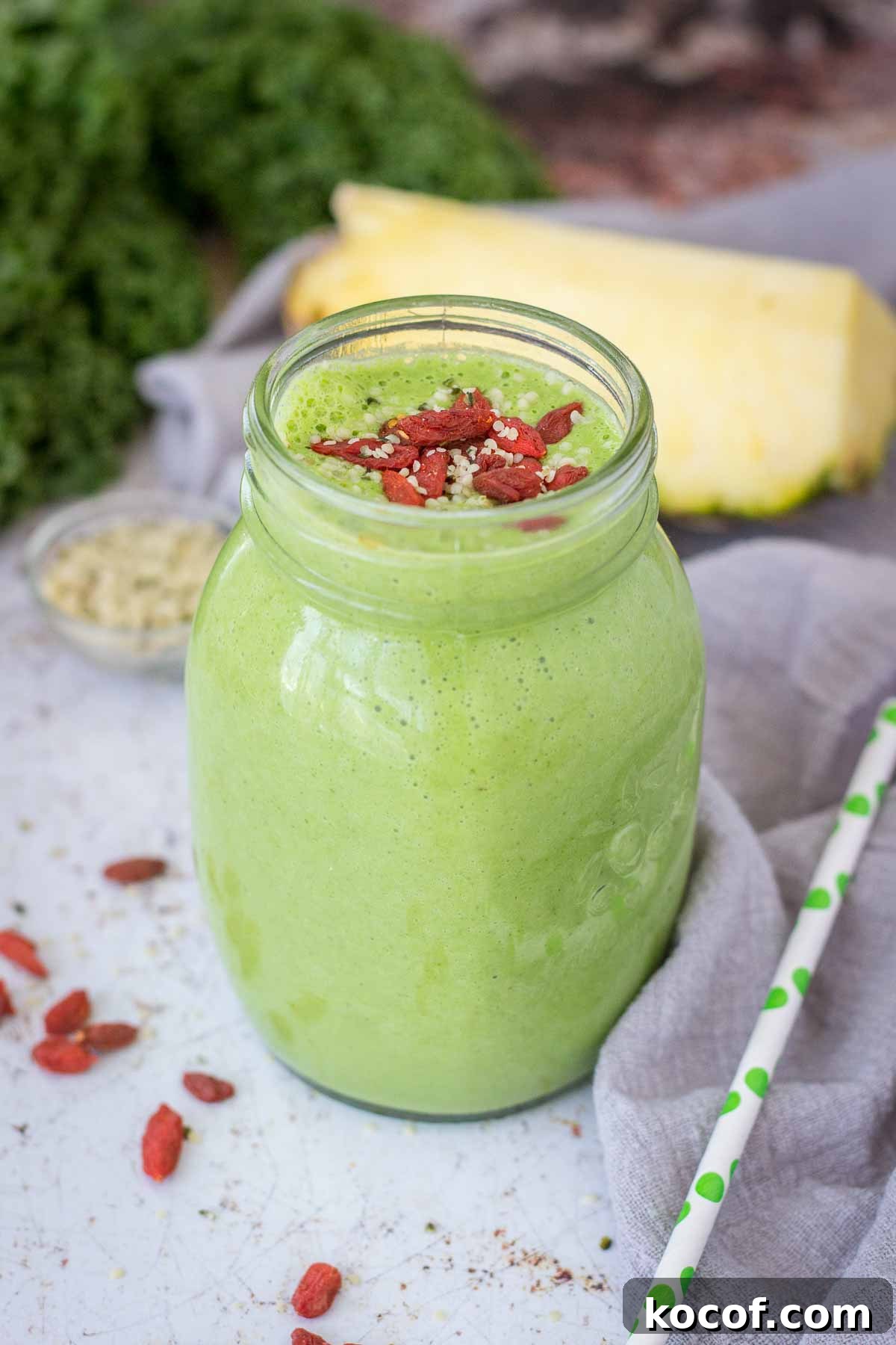 Kale and Pineapple Smoothie for Energy and Glow 5 Kale Pineapple Smoothie in a glass topped with goji berries