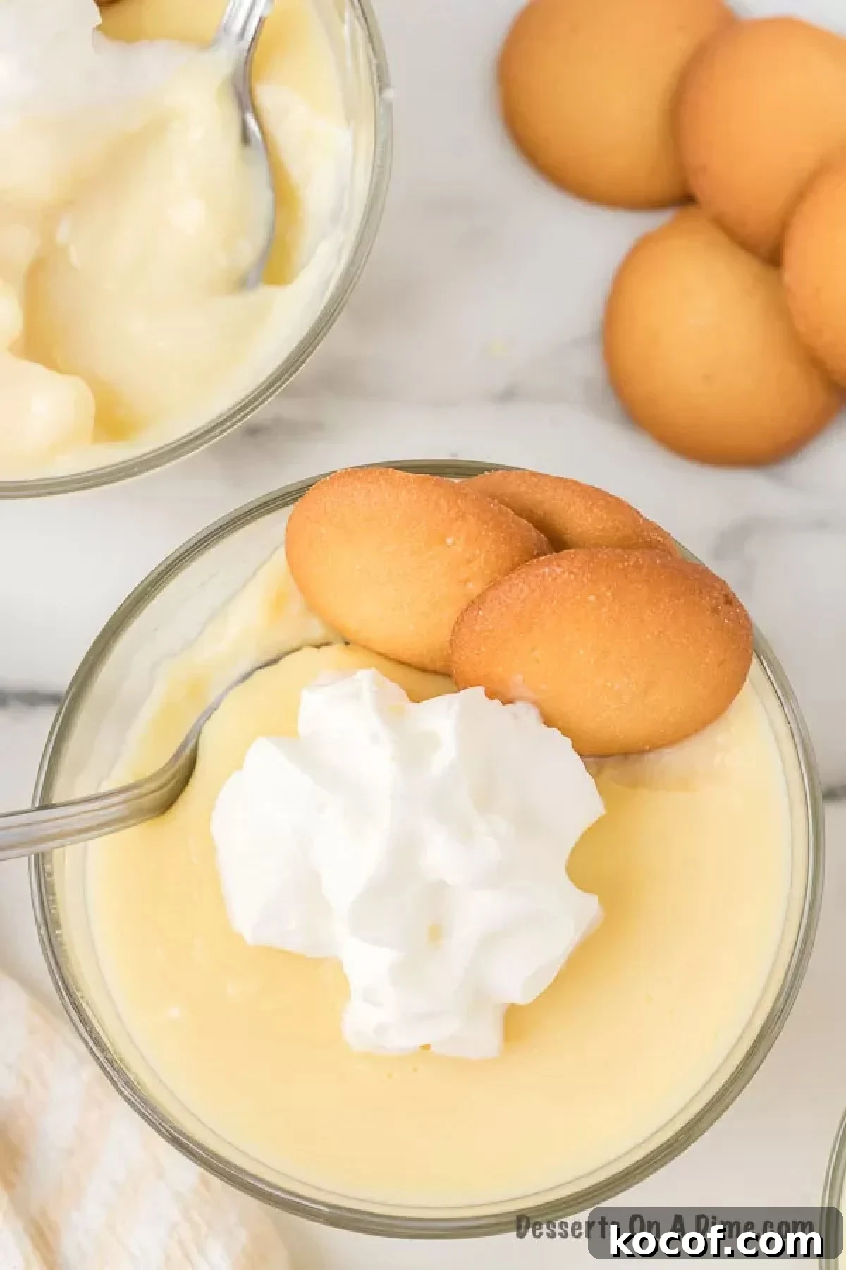 Pudding served in cups and topped with whipped cream. 