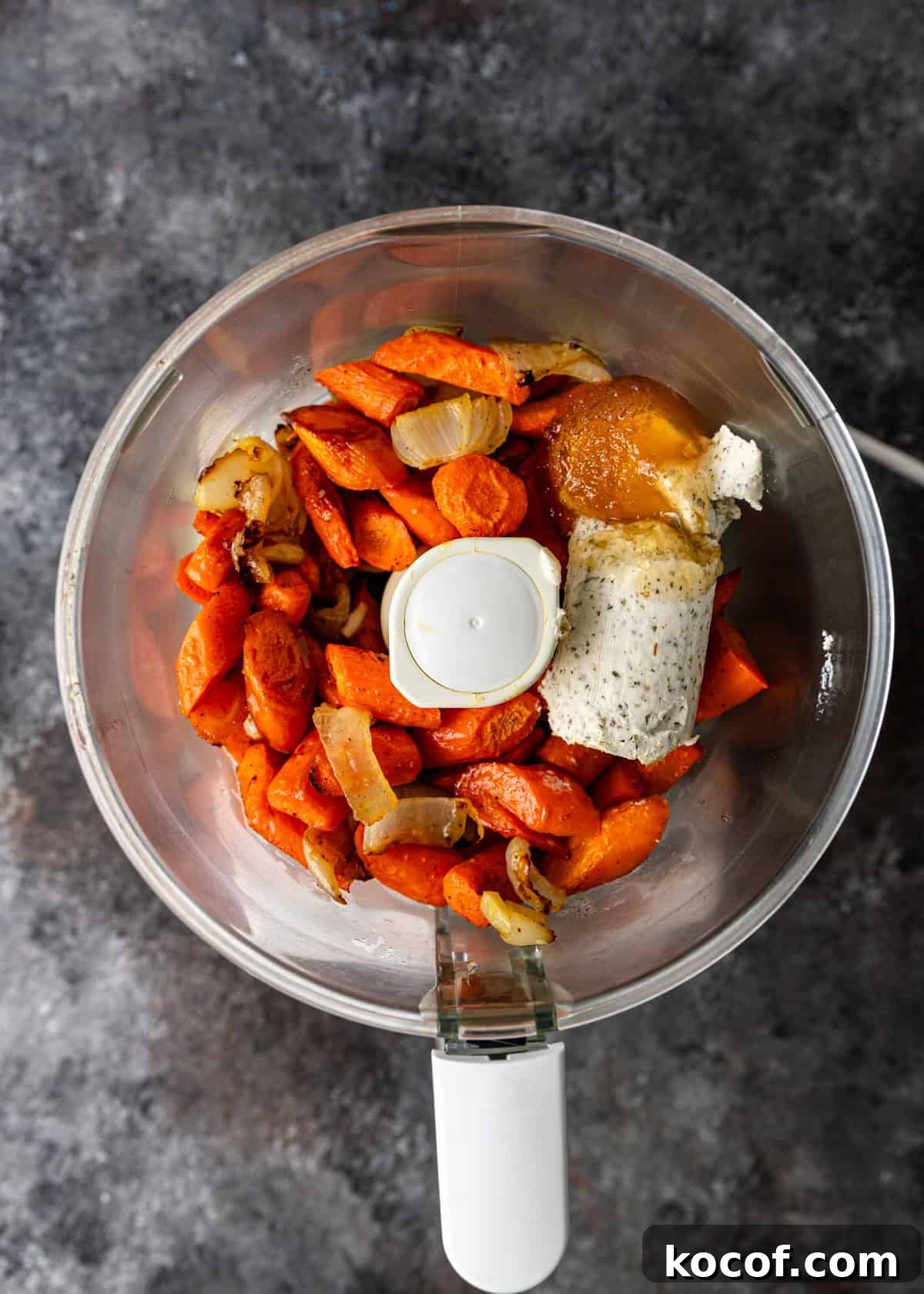 Roasted Carrot and Goat Cheese Dip Recipe for Entertaining 6 overhead process shot: cooked ingredients in food processor to make carrot and goat cheese dip