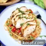 Grilled Chicken Spaghetti Recipe with Smoky Garlic Sauce 3 Plate of spaghetti with red sauce, topped with sliced chicken.