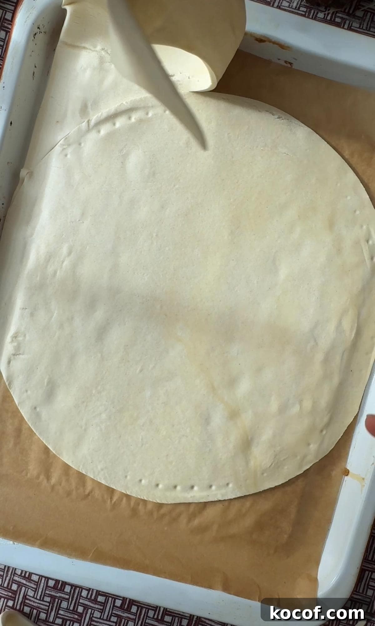cutting out a circle of pastry.