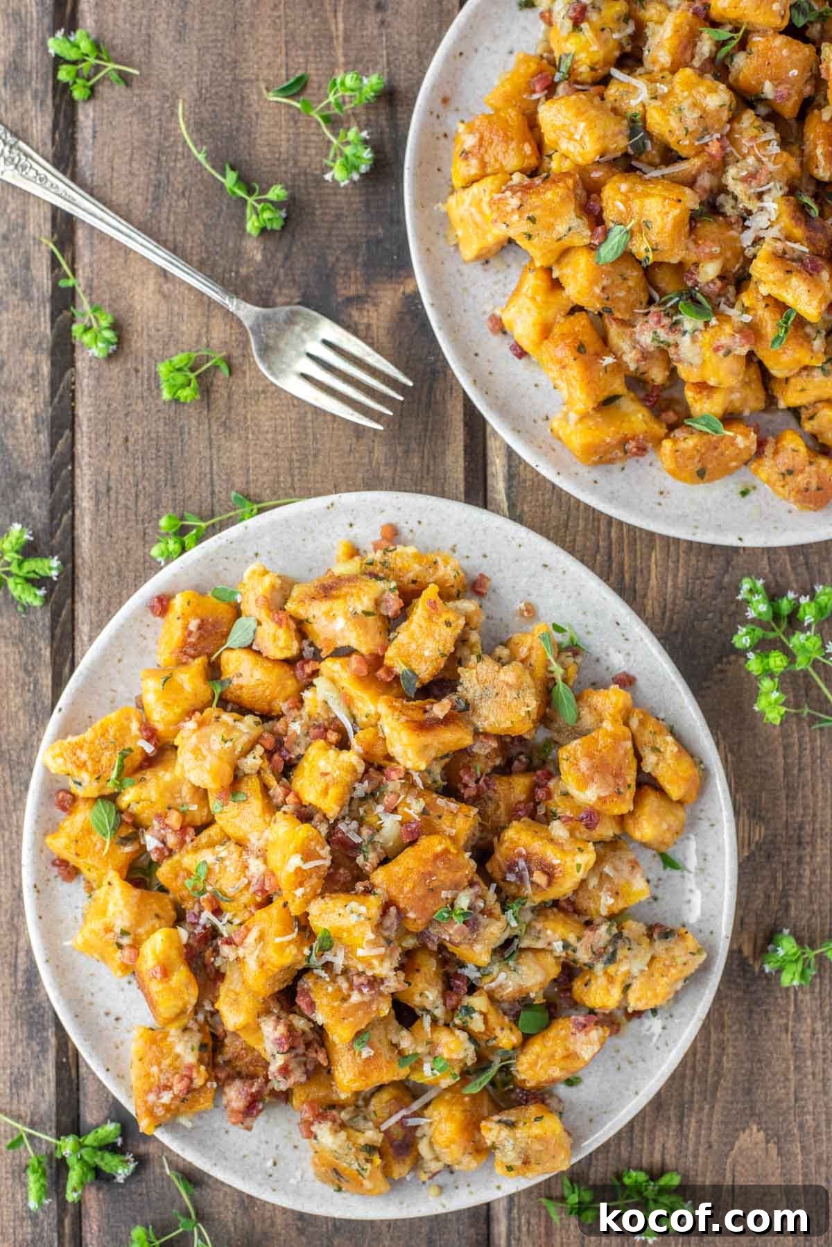 Pumpkin gnocchi on two plates.