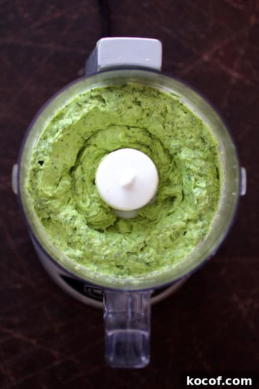Garlic Butter Shrimp Served in Creamy Avocado Halves 3 Photo of avocado butter in mini food processor after blending.