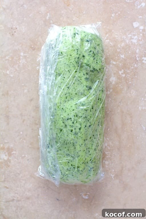 Garlic Butter Shrimp Served in Creamy Avocado Halves 4 Photo of avocado butter rolled into a cylinder in plastic wrap.