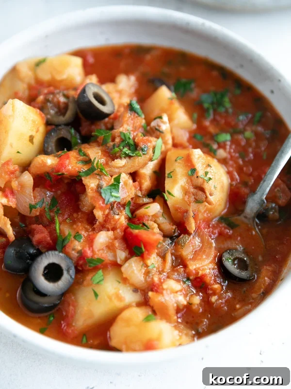 Bacalao made with salted cod, tomatoes, potatoes, shallots, and black olives.