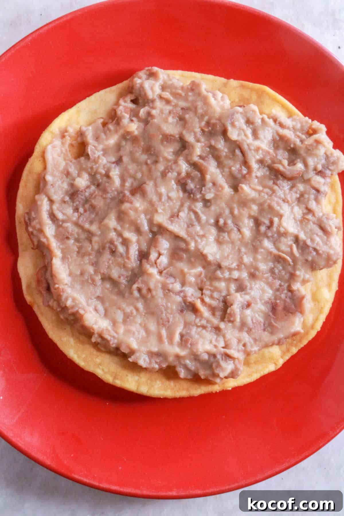 Refried Bean Tostadas with Crispy Tortillas and Fresh Salsa 7 A tostada with refried beans
