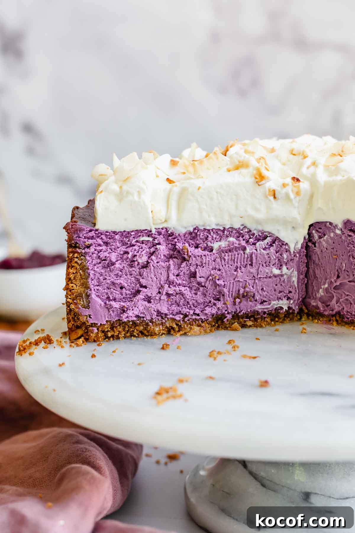 Creamy Ube Cheesecake Recipe: Filipino Purple Yam Dessert 2 Use cheesecake sliced on a platter.