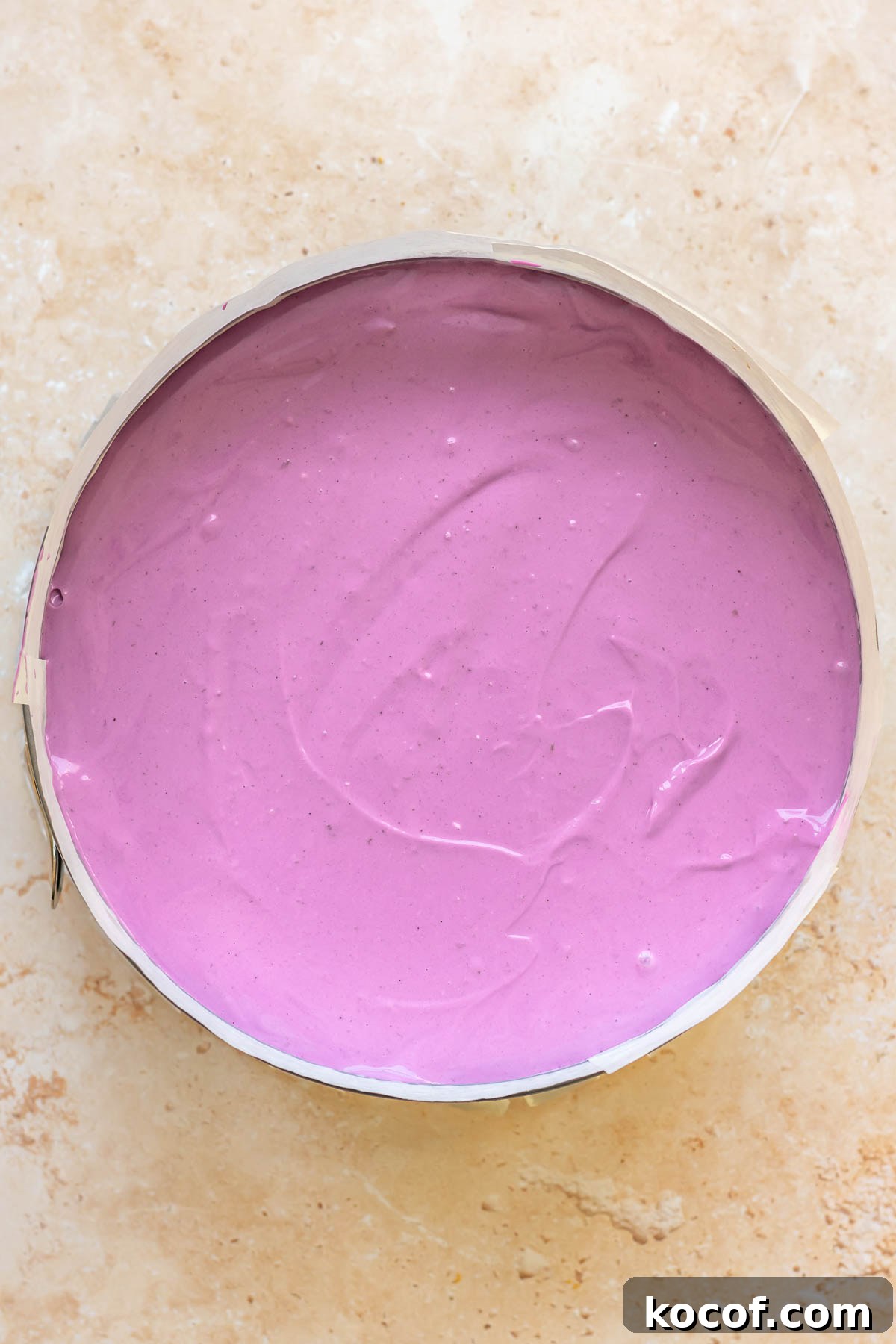 Creamy Ube Cheesecake Recipe: Filipino Purple Yam Dessert 12 Ube batter spread into a prepared springform pan.