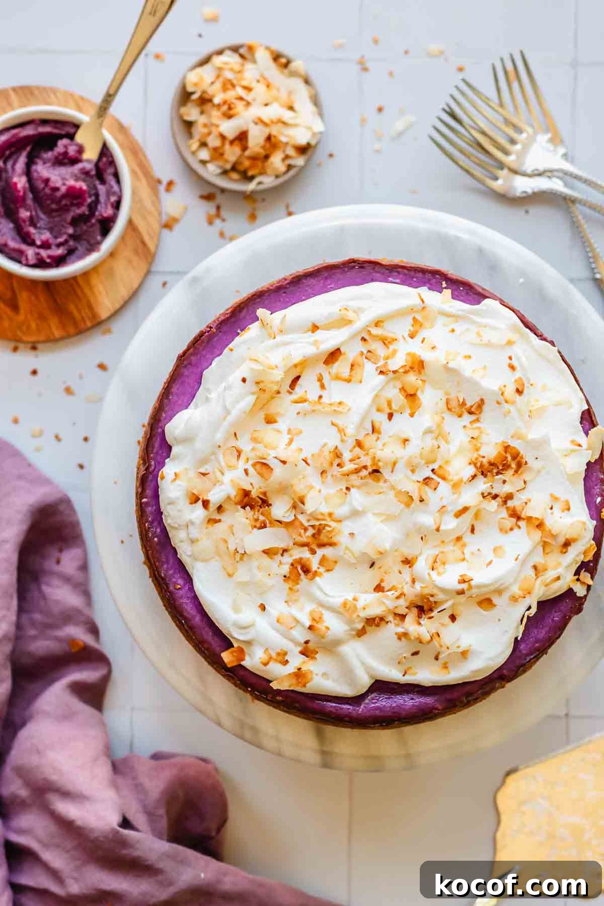 Creamy Ube Cheesecake Recipe: Filipino Purple Yam Dessert 14 Use cheesecake with whipped cream and coconut flakes.