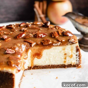 Cross section of the cheesecake with the caramel dripping down.