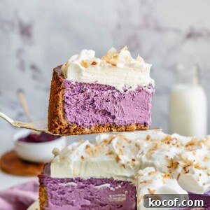 Creamy Ube Cheesecake Recipe: Filipino Purple Yam Dessert 20 A pie server holds up a piece of sliced cube cheesecake.