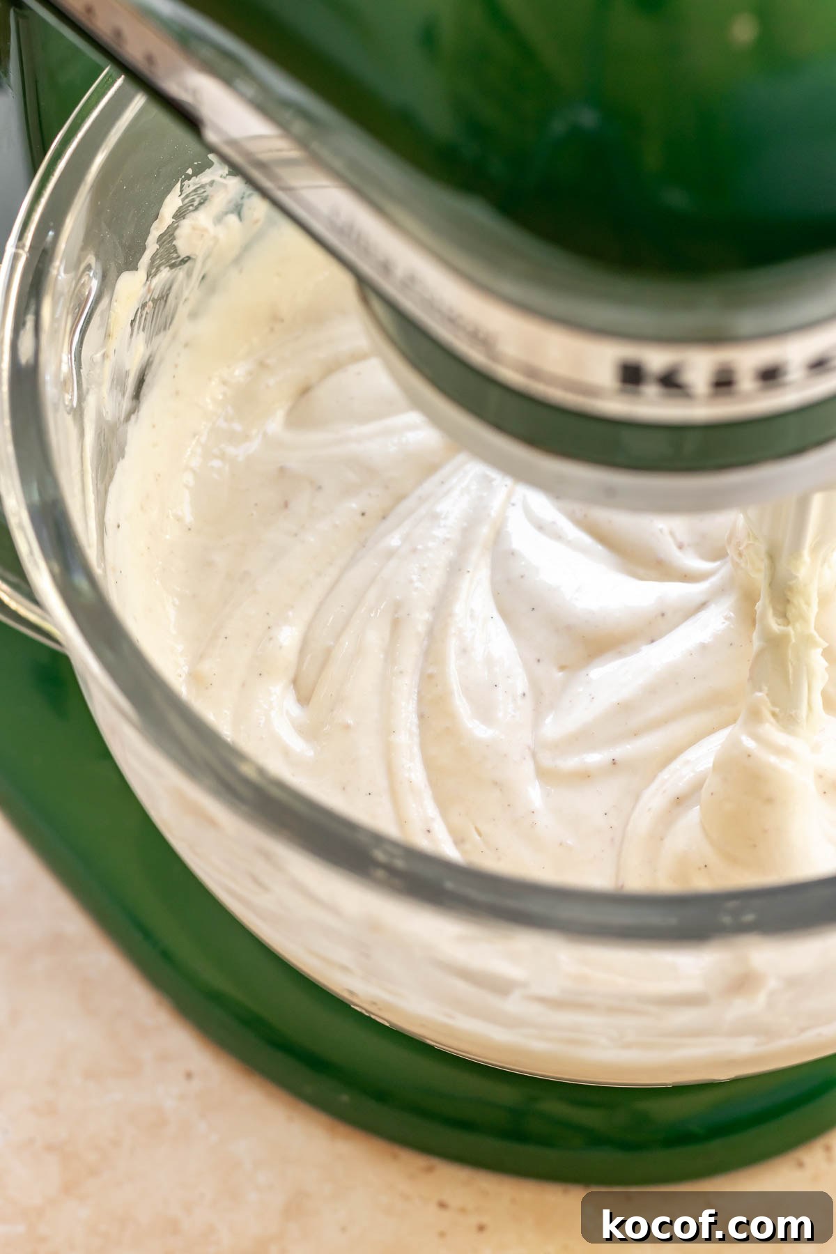 Creamy Ube Cheesecake Recipe: Filipino Purple Yam Dessert 10 Cheesecake batter in a stand mixer bowl.