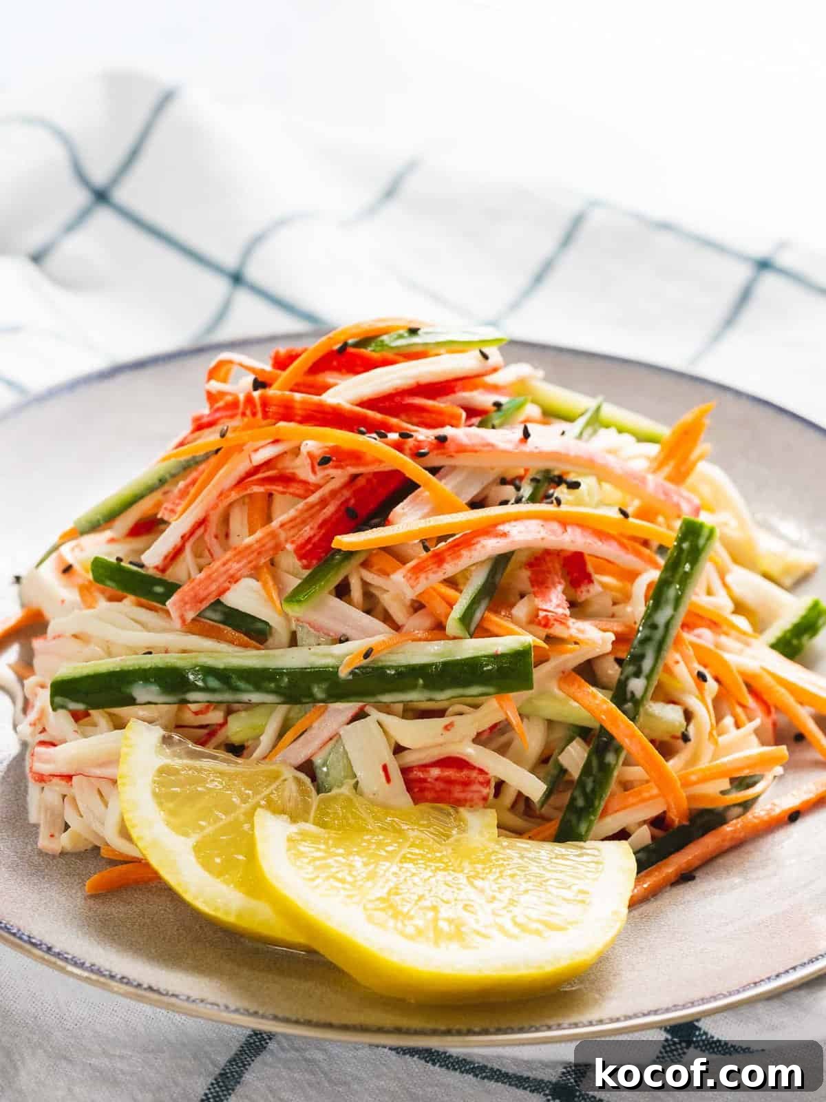 Crunchy Kani Salad Recipe with Crab Sticks and Fresh Veggies 2 Kani salad with shredded crab stick and julienned carrots and cucumbers.