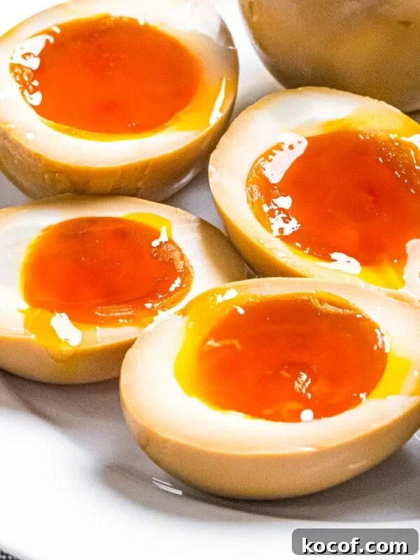 Crunchy Kani Salad Recipe with Crab Sticks and Fresh Veggies 10 Ramen eggs marinated in soy sauce cut in half to reveal soft boiled eggs with runny yolks.
