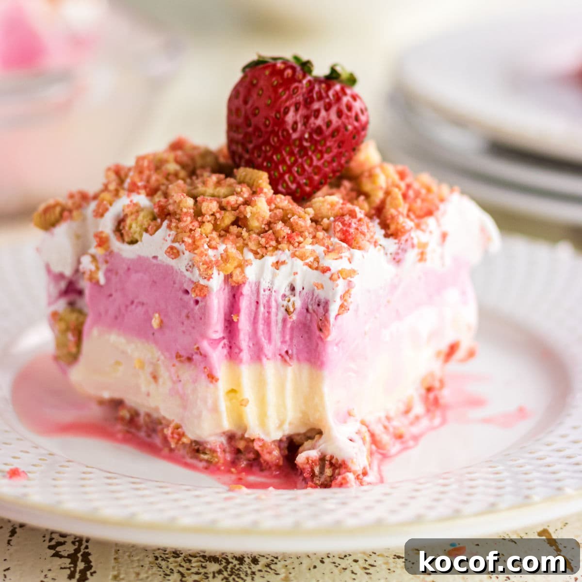 Classic Summer Strawberry Dessert Recipes You’ll Love 12 A closeup of the ice cream cake showing the layers.