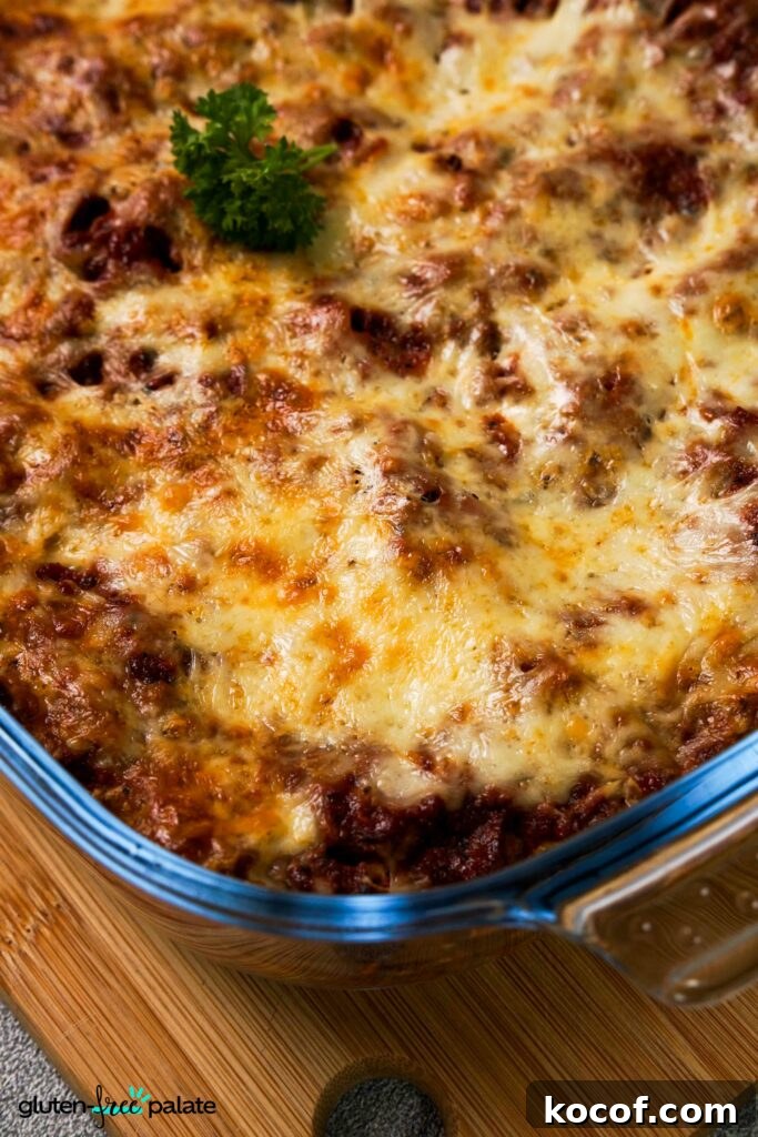 Gluten-Free Lasagna Made Faster: Time-Saving Shortcuts 7 Zoomed in view of Gluten-Free lasanga in a glass casserole dish.