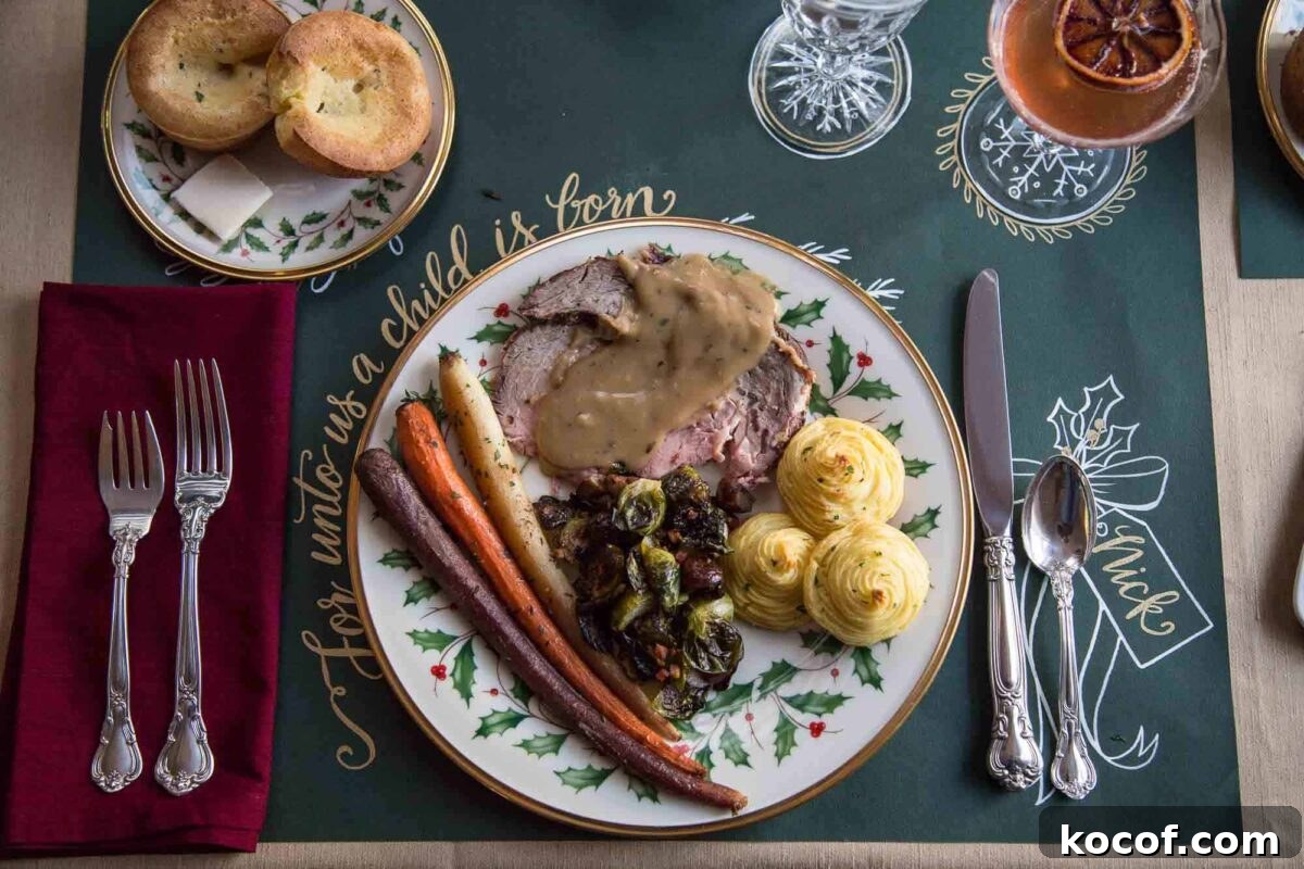 Herb-Roasted Prime Rib Roast: Tender, Juicy Holiday Recipe 3 white china plate with prime rib, duchess potatoes, and roasted carrots on a green printed placemat.