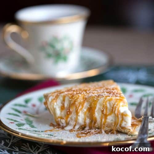 slice of eggnog pie covered in caramel sauce on a Christmas china plate.