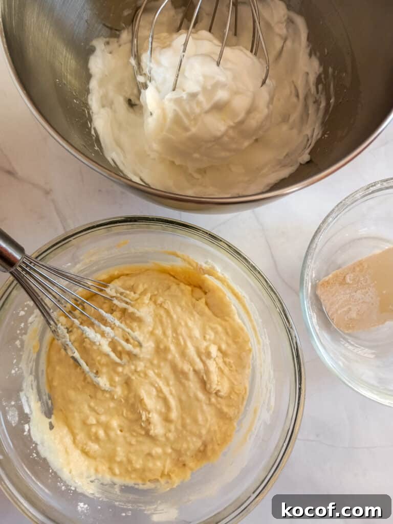 Bowl with whipped egg whites and the remaining batter.