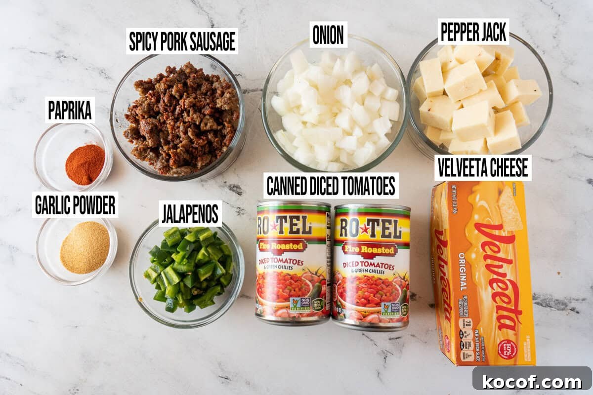 smoked queso ingredients in individual bowls and labeled.