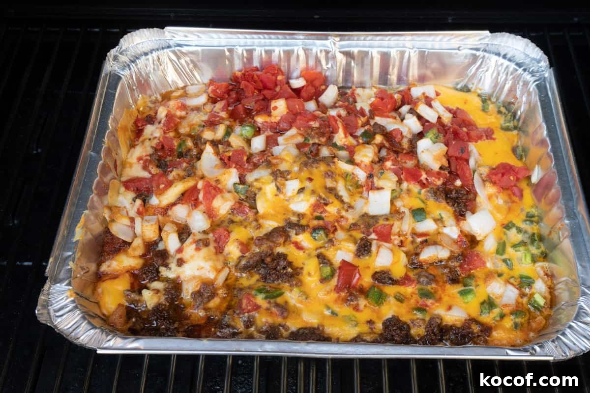 queso in an aluminum pan, unmixed, smoked on smoker.