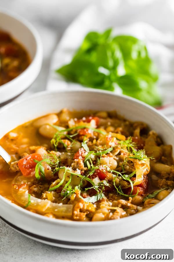 Hearty Italian Sausage, Fennel & White Bean Soup Recipe 5 Italian Sausage Fennel White Bean Soup served with basil.