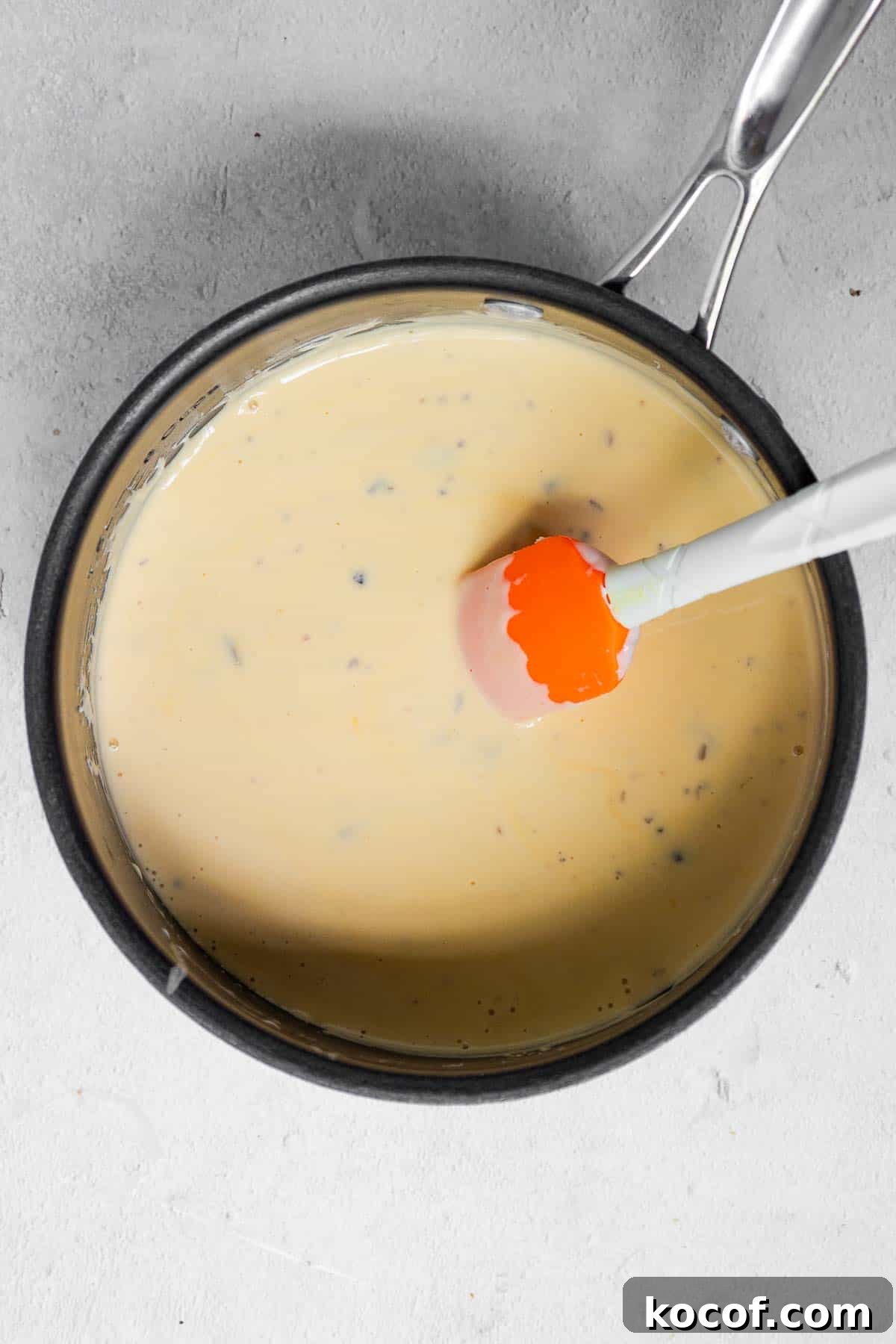 Velveeta Green Bean Casserole Recipe: Creamy, Cheesy Holiday Side 4 The cubed Velveeta cheese is melted into the warm soup mixture.