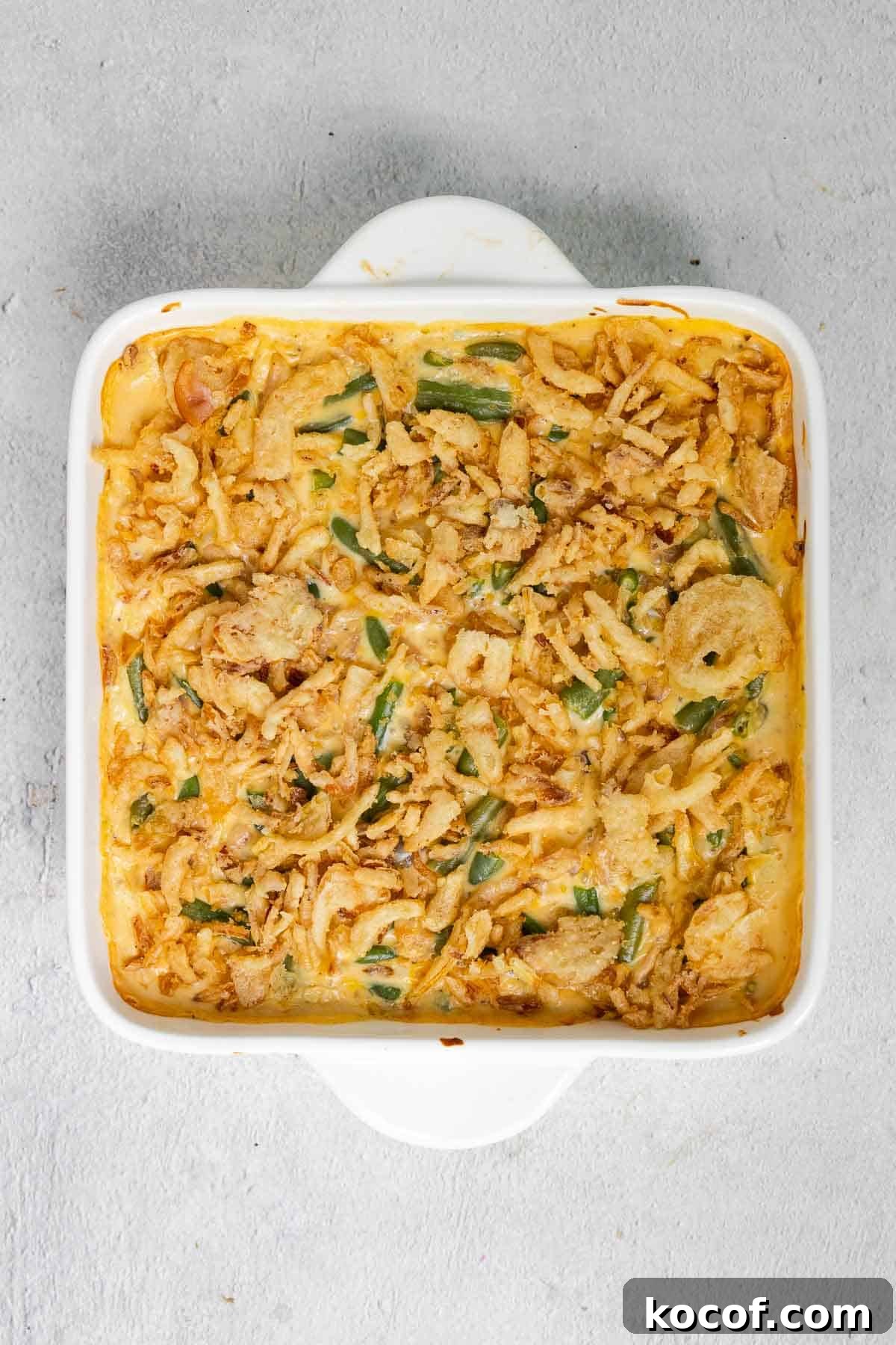 Velveeta Green Bean Casserole Recipe: Creamy, Cheesy Holiday Side 8 Crispy fried onions are added to the top of the warm casserole mixture.
