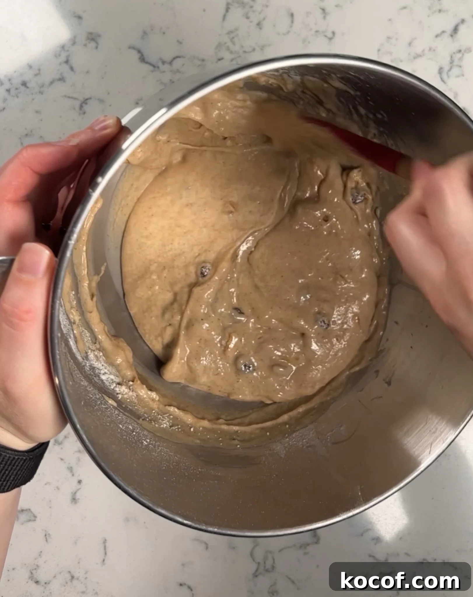Folding together the batter.