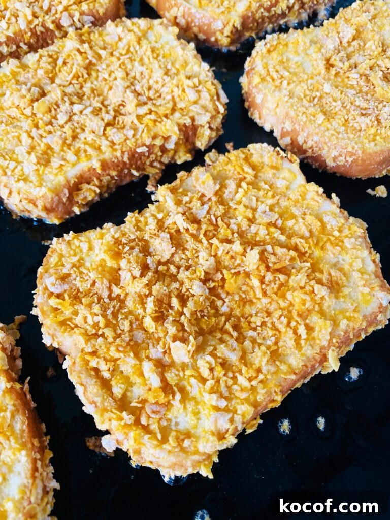 Blackstone Frosted Flake French Toast Recipe — Crispy Sweet Skillet Breakfast 7 french toast before flipping