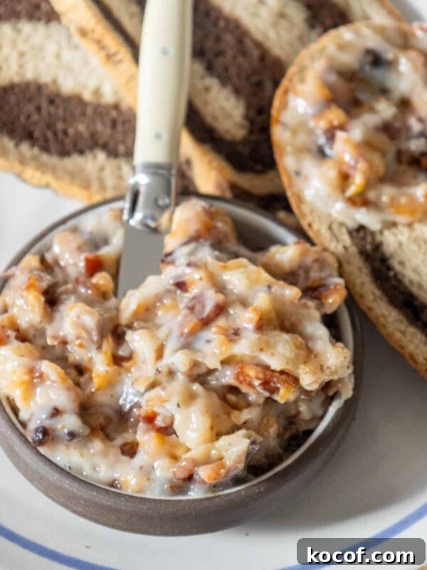 A bowl of Polish spread and a plate with a smalec-spreaded piece of bread.
