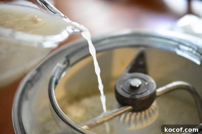 Adding Water to the Spanish Bread mixture