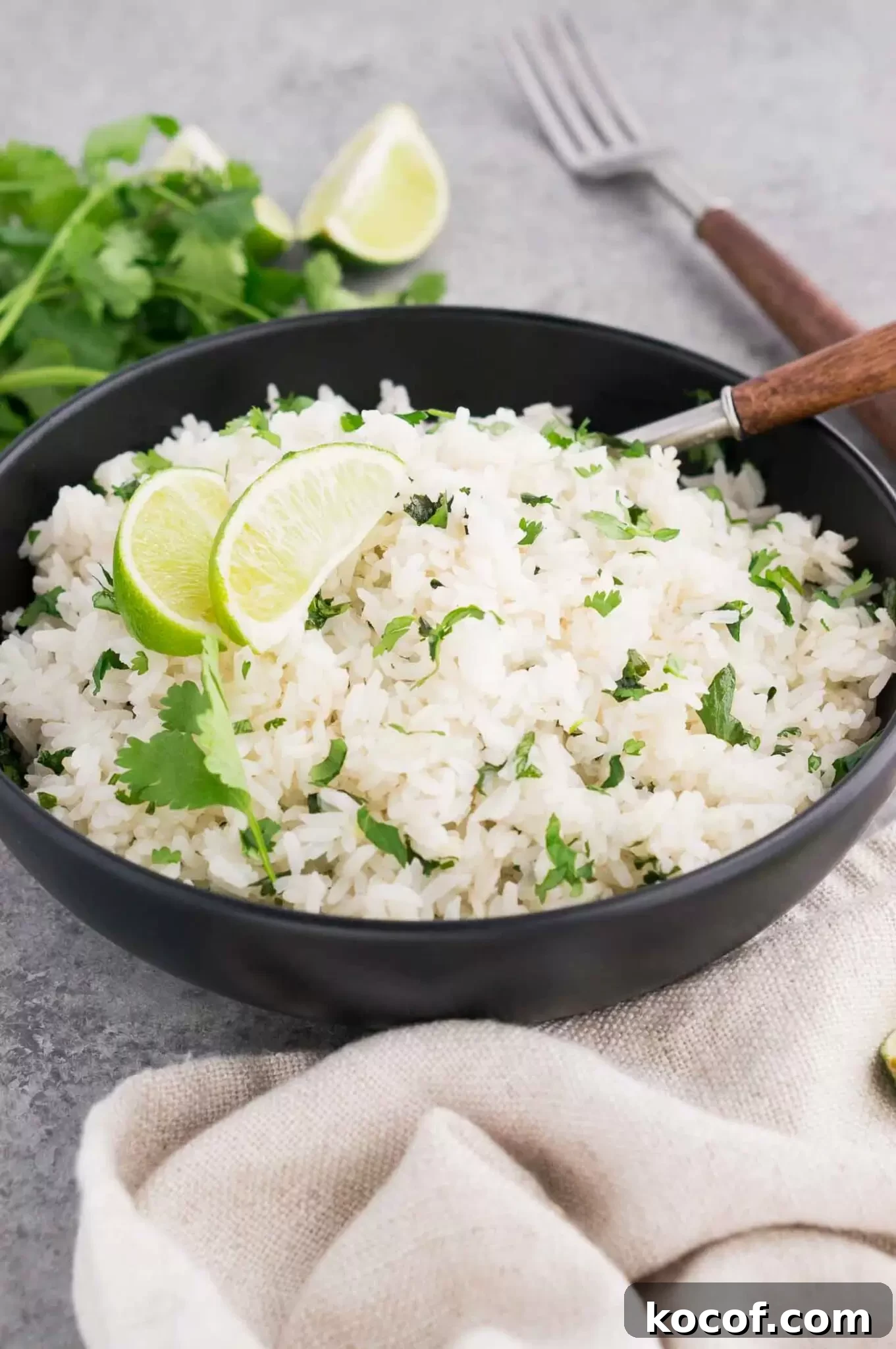 Cilantro Lime Rice Recipe: Flavorful Aromatic Side Dish 7 cilantro rice with lime in a black bowl