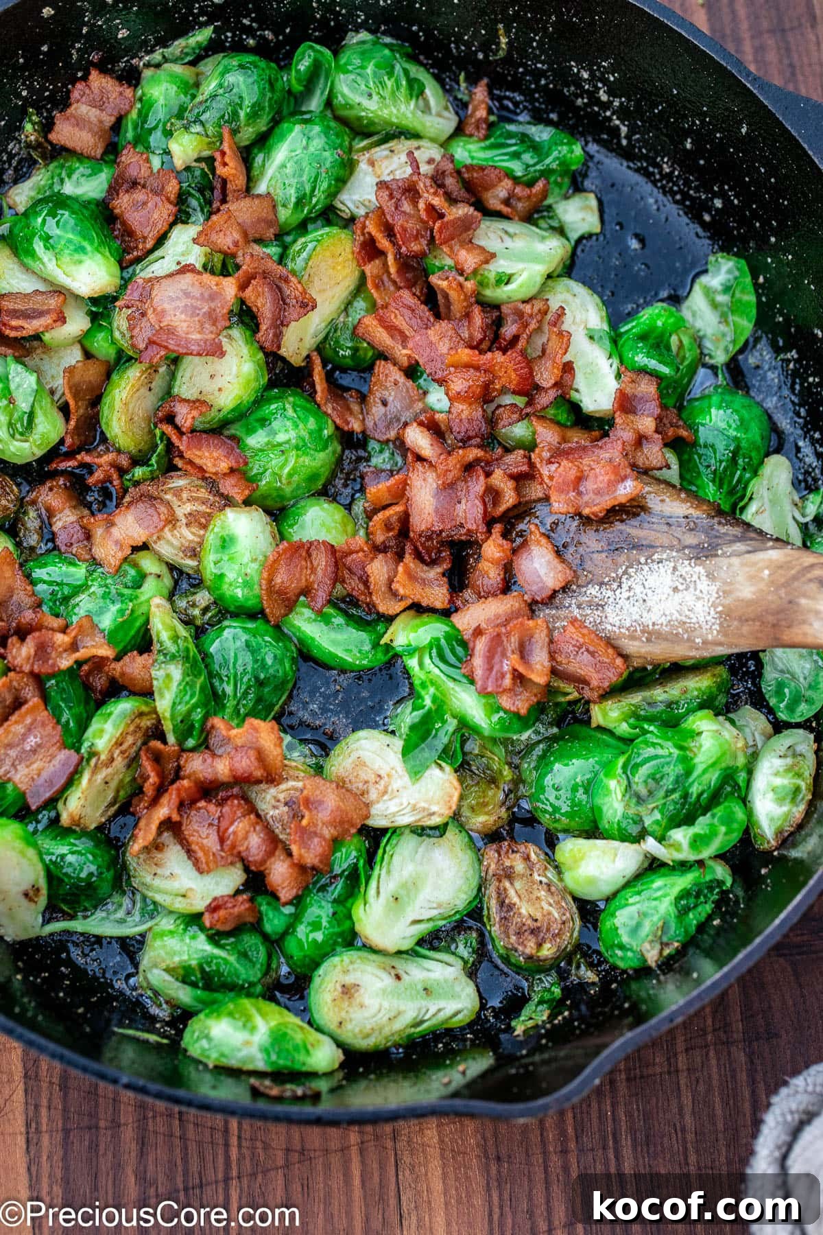 Crispy Pan-Fried Brussels Sprouts with Bacon and Garlic 9 Pan fried Brussels sprouts in a skillet with bacon.