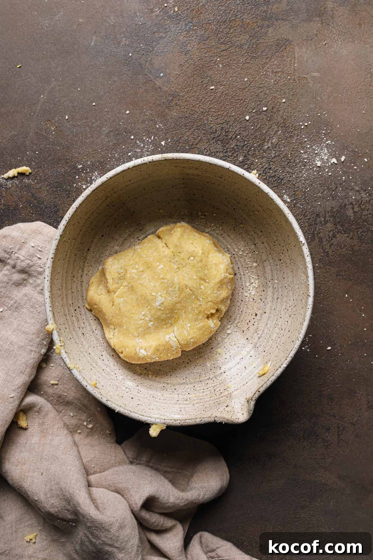 Italian Pasta Frolla Shortcrust Recipe for Tarts & Cookies 12 A large bowl with a piece of dough.