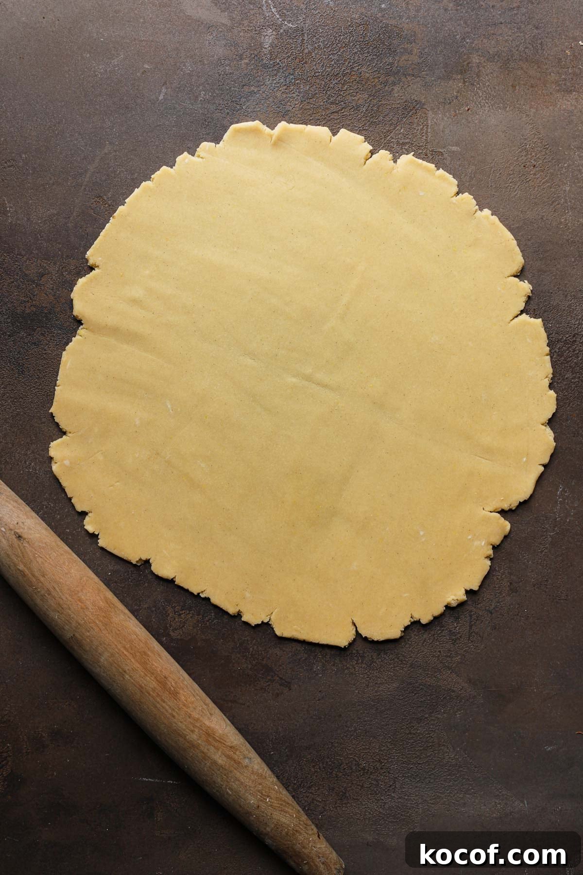 Italian Pasta Frolla Shortcrust Recipe for Tarts & Cookies 13 Rolled dough next to a rolling pin.