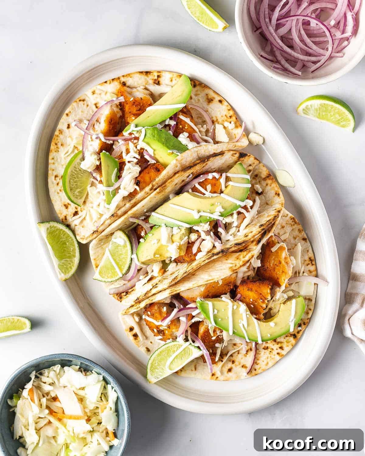 A platter of three air fryer fish tacos.