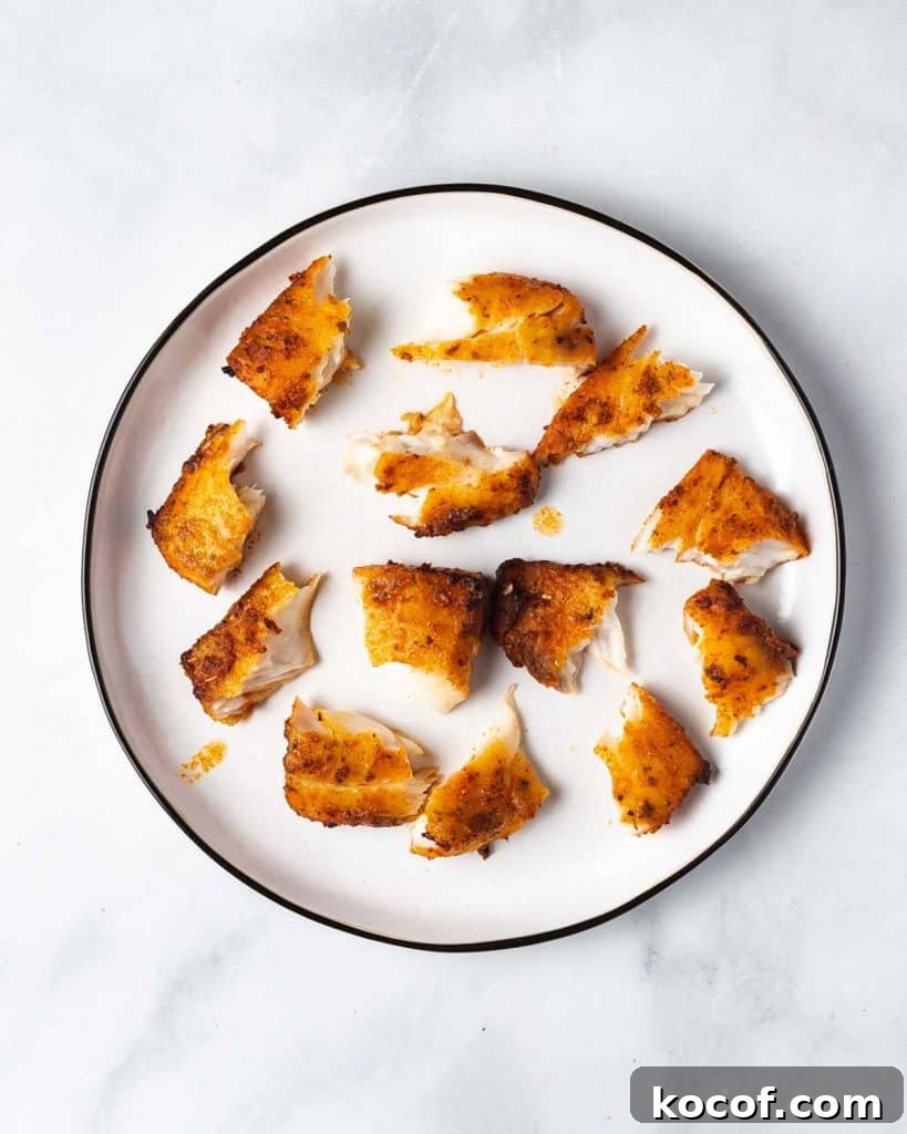 A plate of air fried fish torn apart.