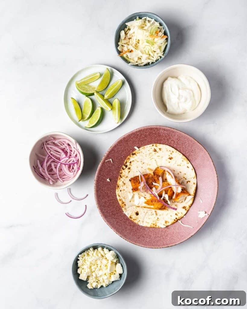 A plate with a fish taco with toppings around it.