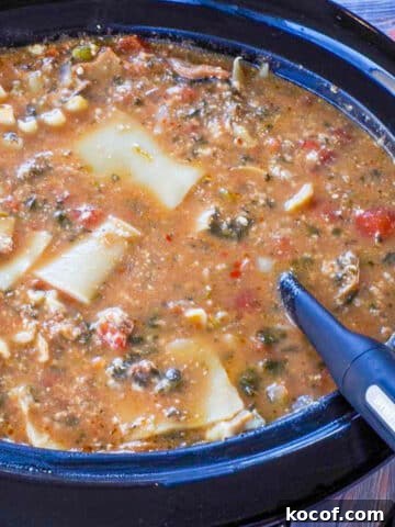 lasagna soup in slow cooker with ladle