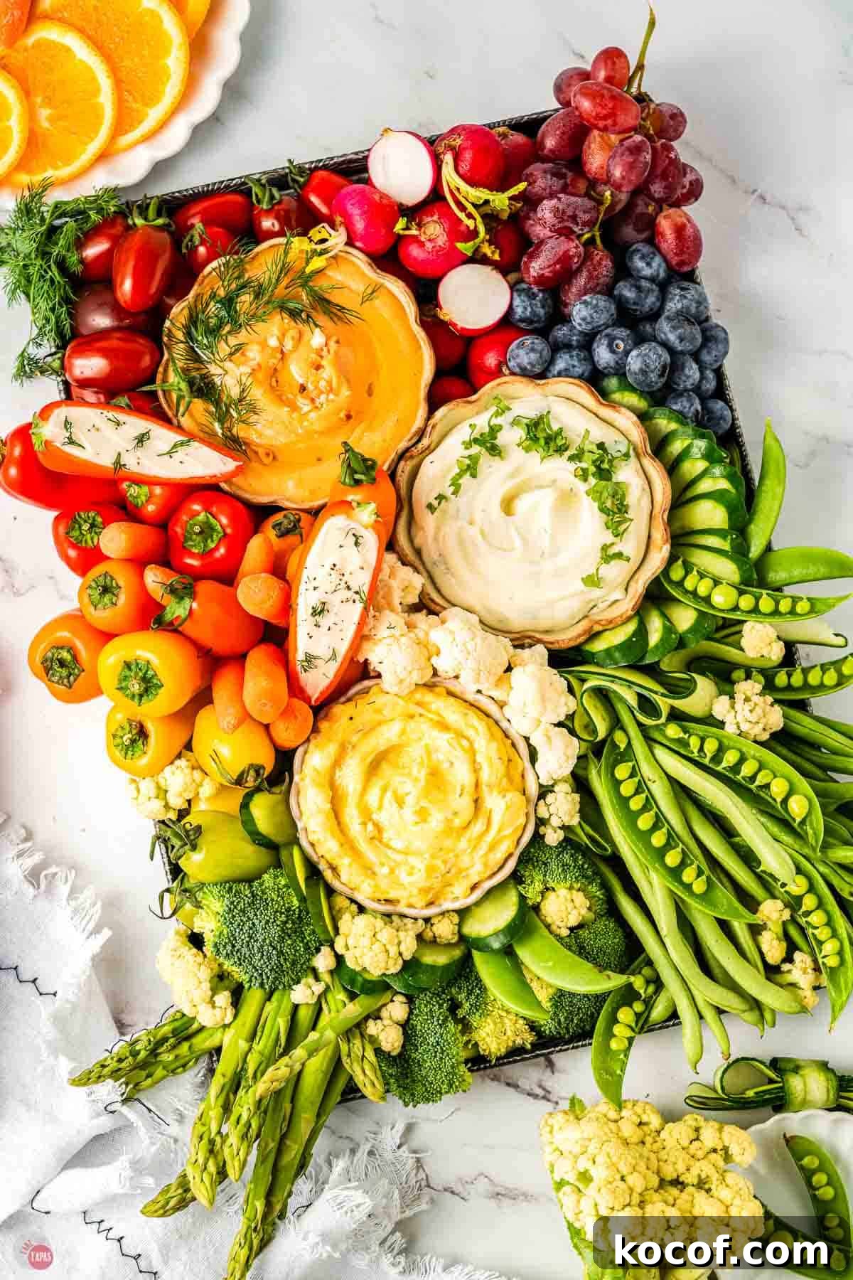 angled crudite platter with fresh vegetables and dips