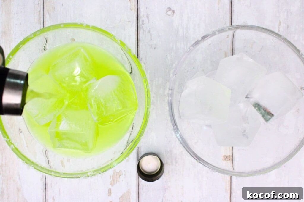 shake and strain midori margarita into a glass