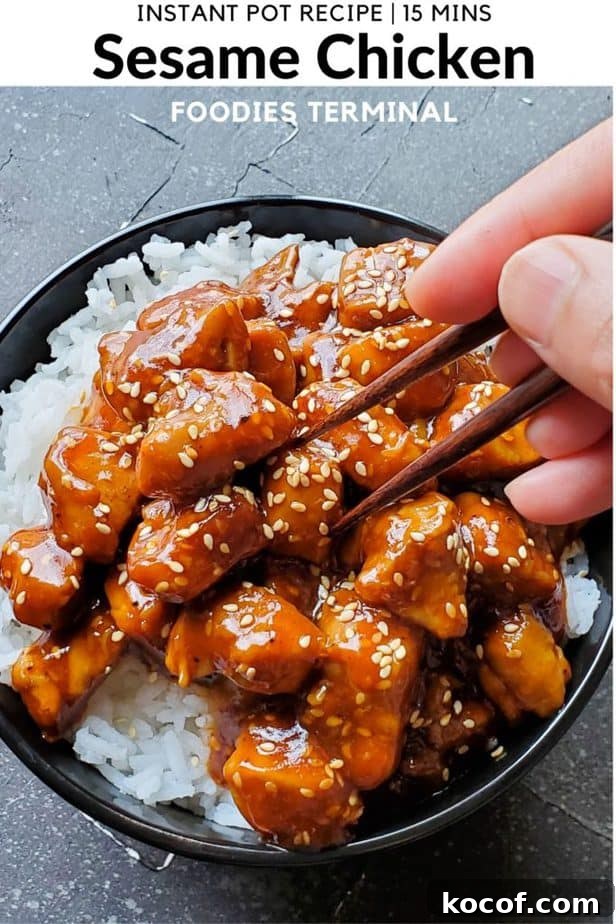 instant pot sesame chicken on jasmine rice in black bowl garnished with sesame seeds with chopsticks