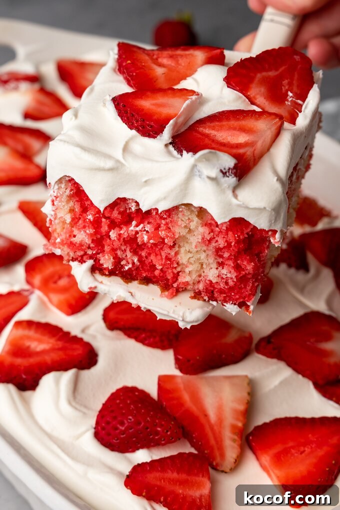 Moist Strawberry Poke Cake Recipe with Fresh Strawberry Filling 6 img 18725 12