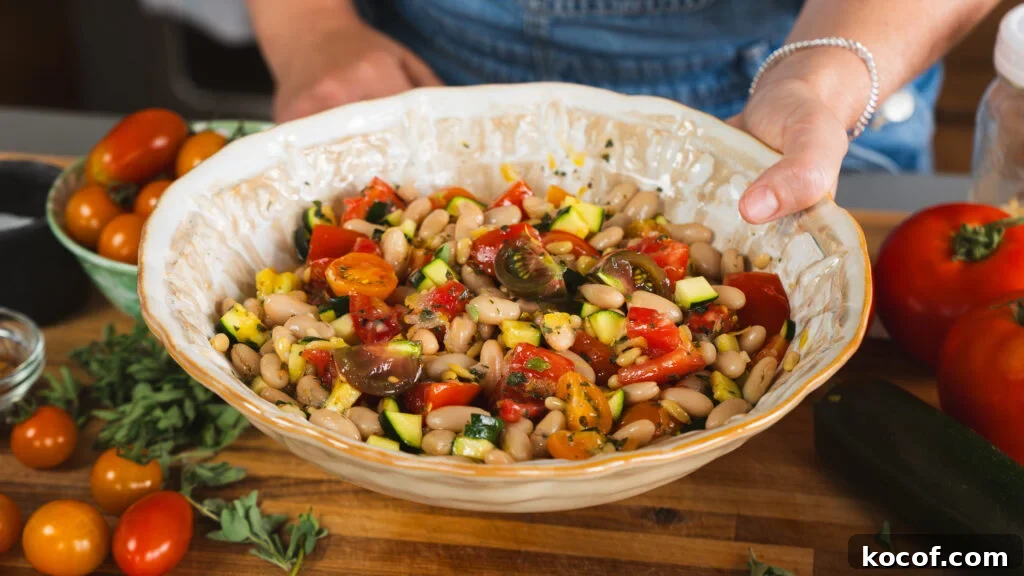 Zucchini tomato salad in a large serving bowl.