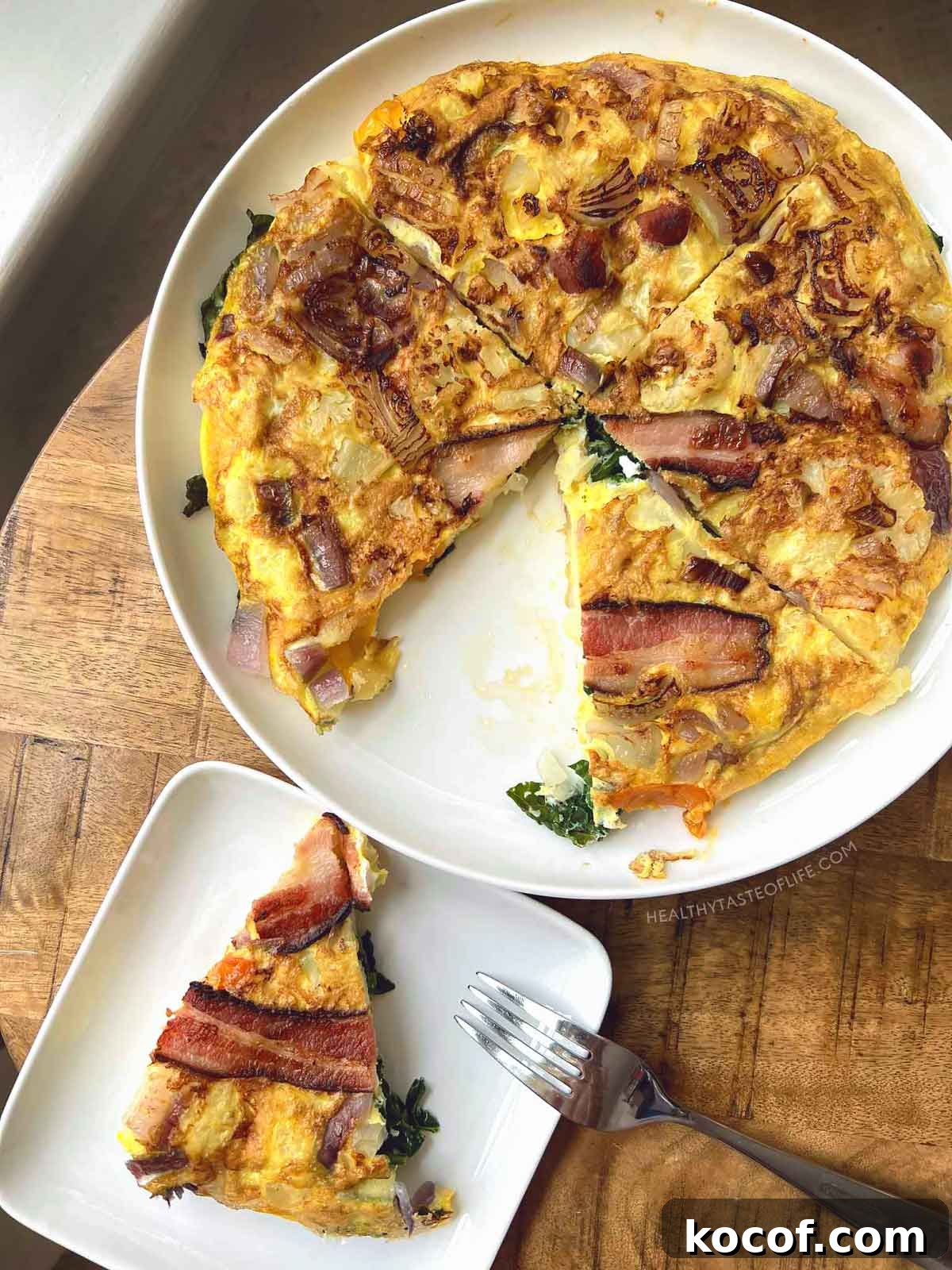 Healthy breakfast omelette low carb with veggies above shot slice cut out.