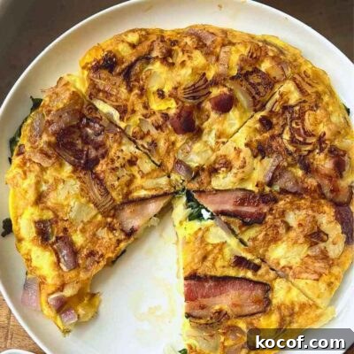 Omelette with cauliflower veggies and bacon - sliced featured image
